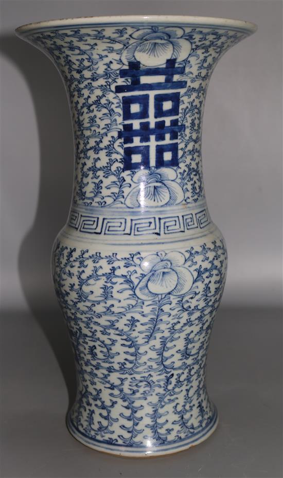 A Chinese blue and white sweet pea beaker vase, 19th century, 37cms, with hardwood stand